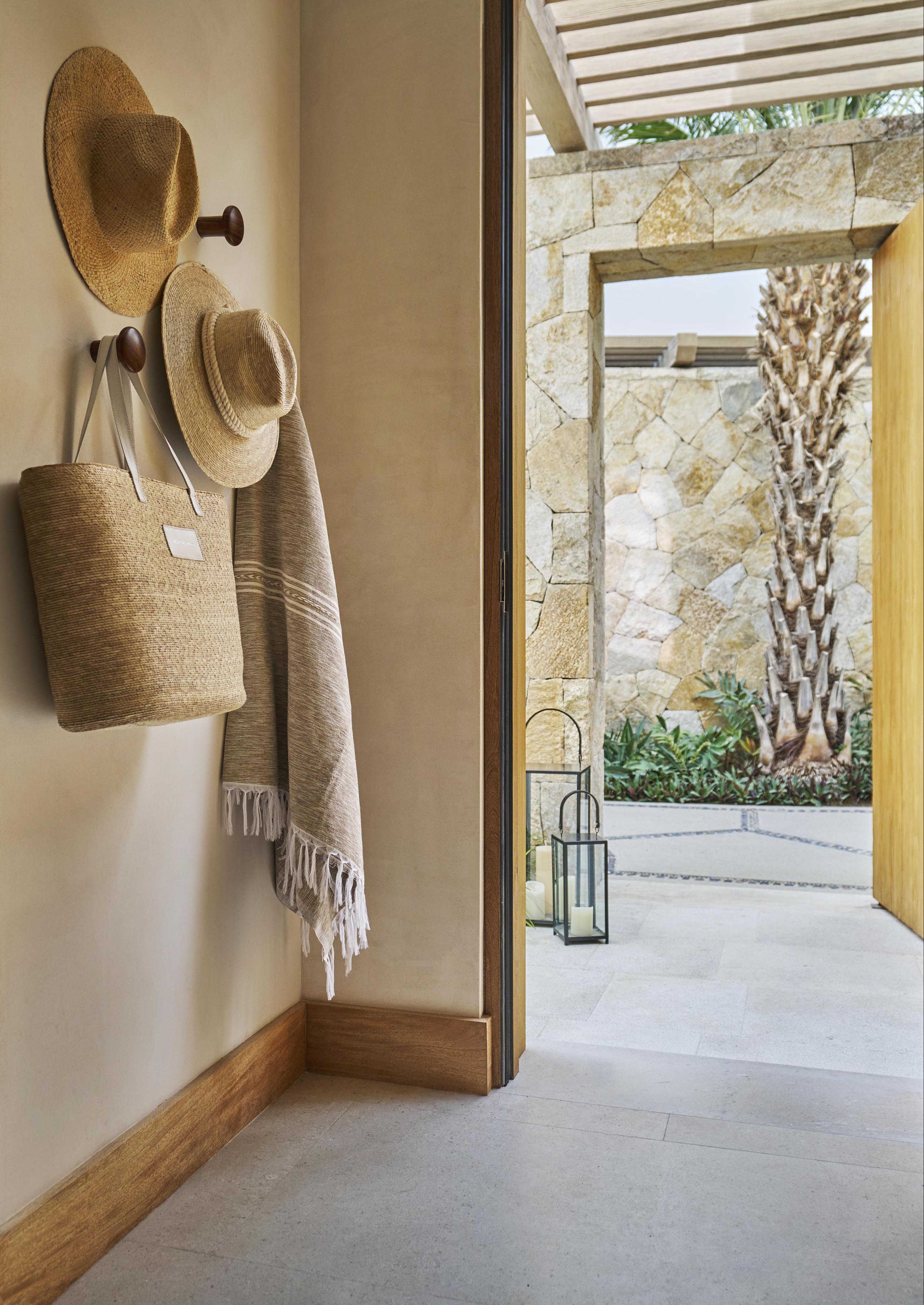 Entryway of Four Seasons Los Cabos casita with modern architecture view to outside stoned paved walkway