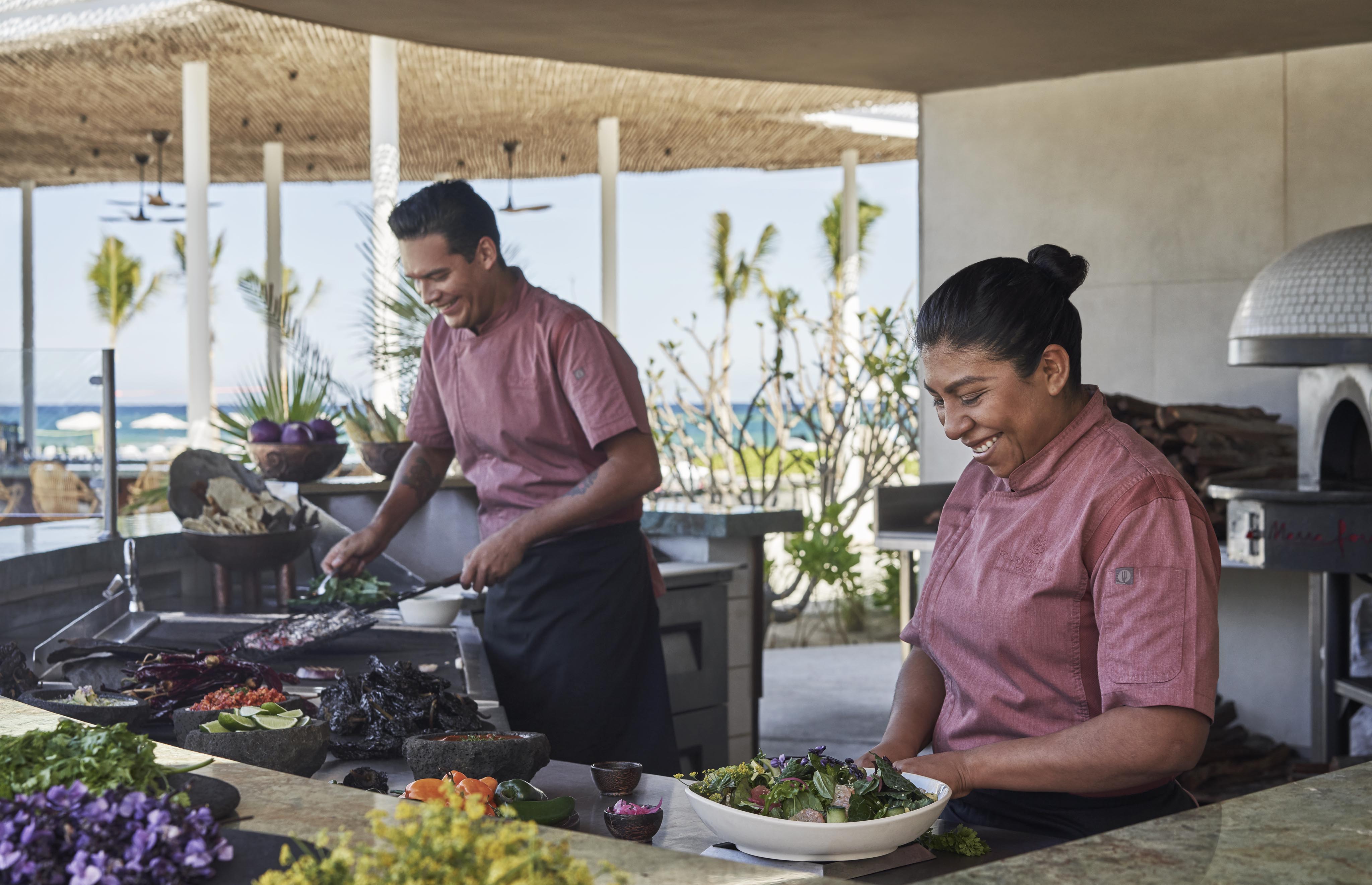 Open air Four Seasons Los Cabos Case de Brasakitchen with chefs cooking at luxury Four Seasons Los Cabos