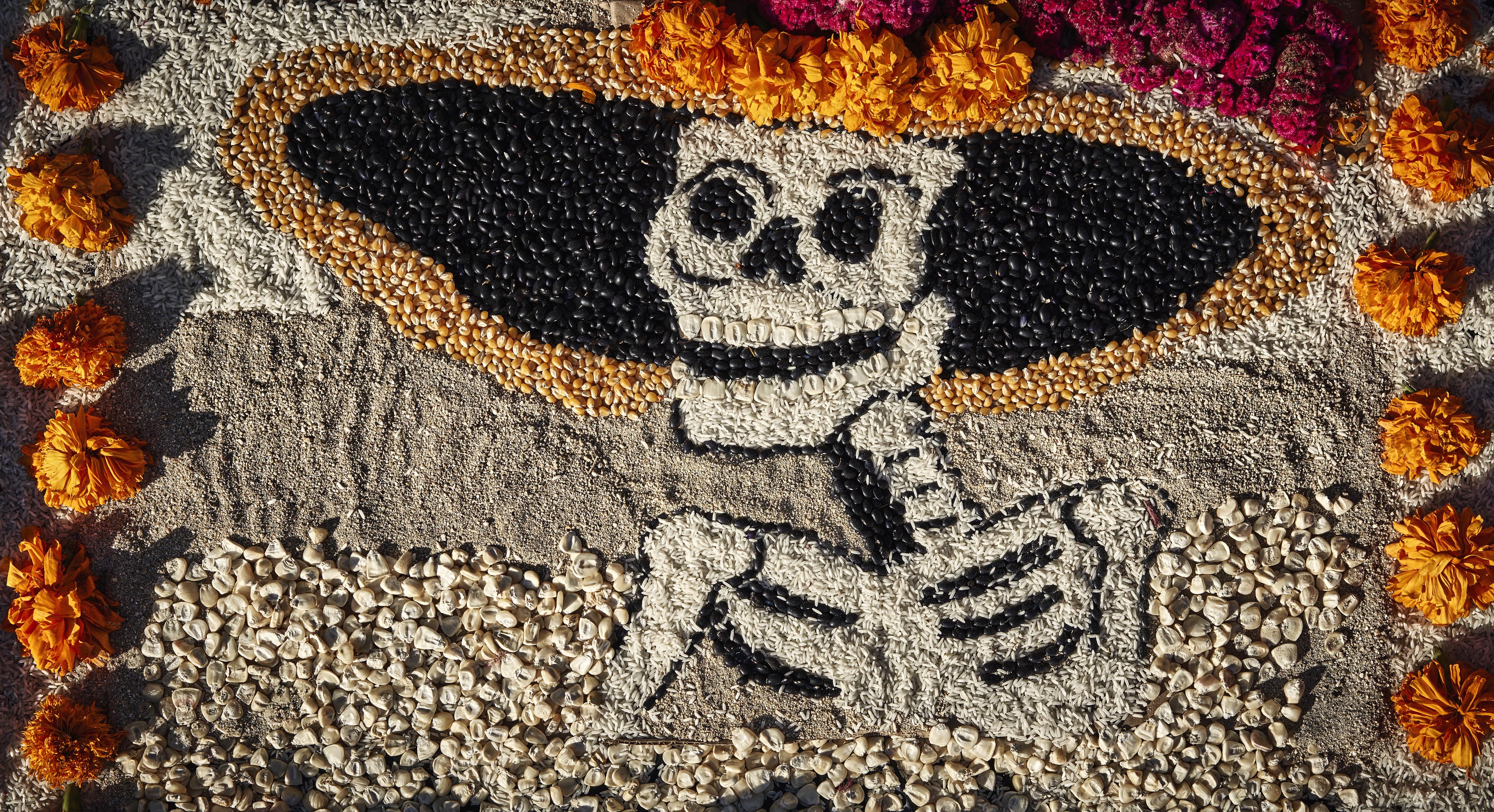 Dia de los muertos handmade art surrounded by marigolds
