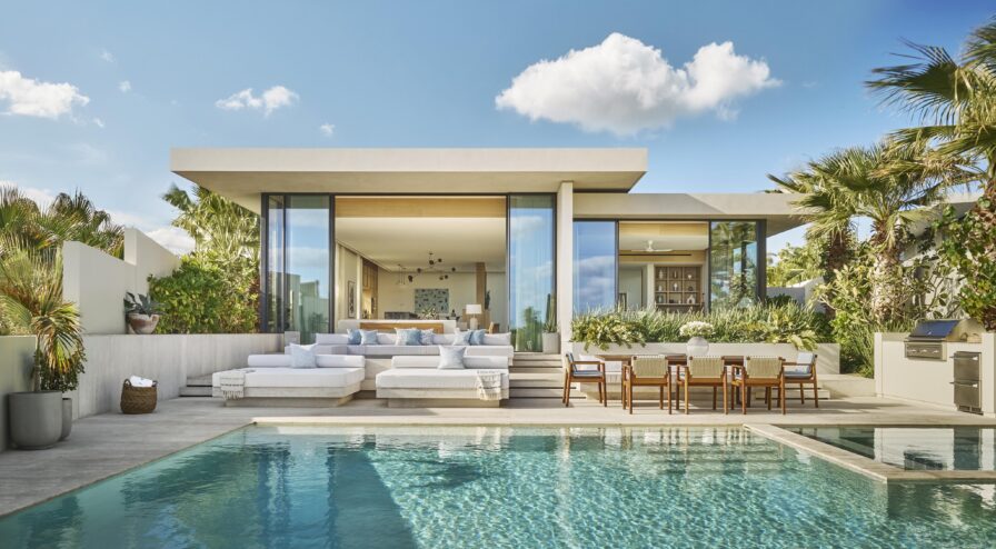 Modern outdoor terrace of luxury villa, outdoor furnishing and rectangular pool