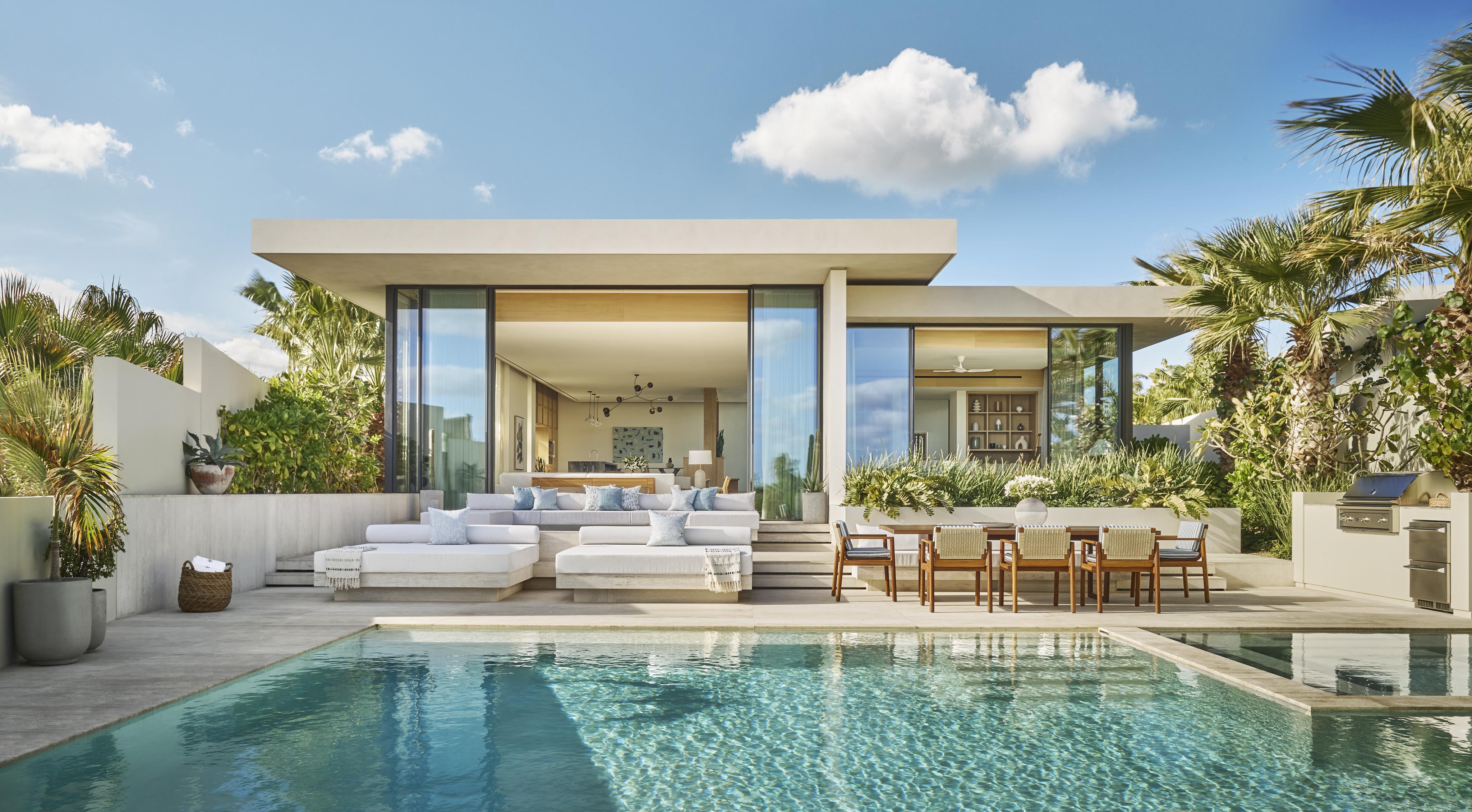 Modern outdoor terrace of luxury villa, outdoor furnishing and rectangular pool