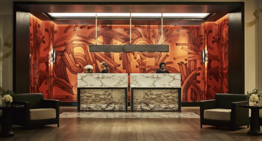 Colorful Four Seasons Mexico City lobby desk with modern marble desk and pendant light