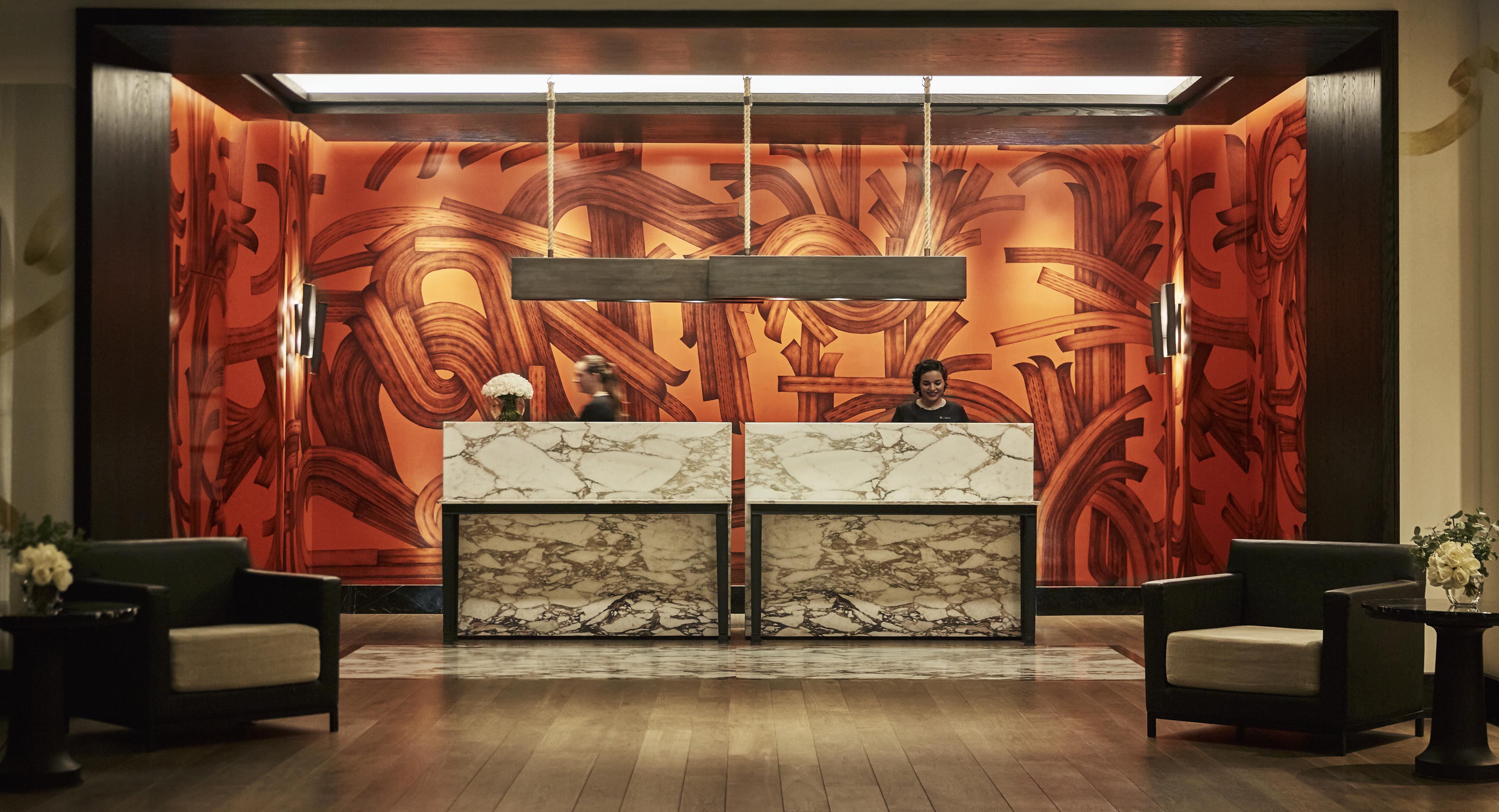 Colorful Four Seasons Mexico City lobby desk with modern marble desk and pendant light