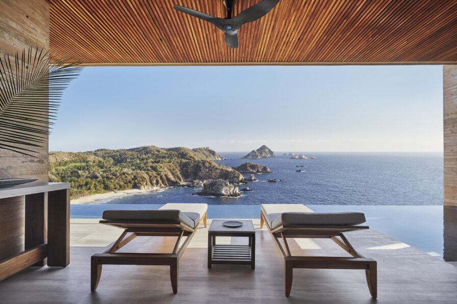 Open air luxury Four Seasons Tamarindo patio with chaise lounge and ocean view
