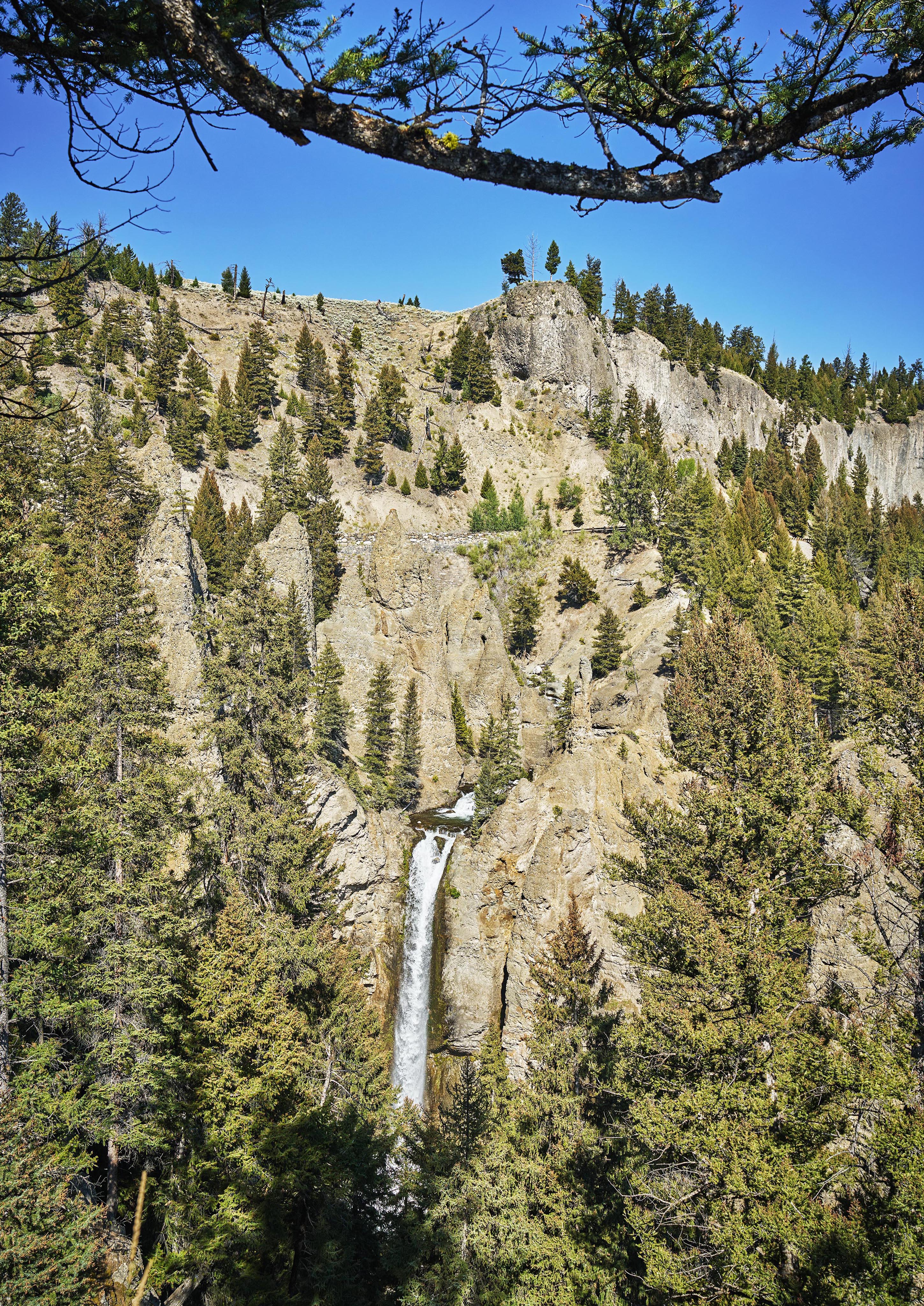 Mountain view waterfall rockface tree covered, Big Sky