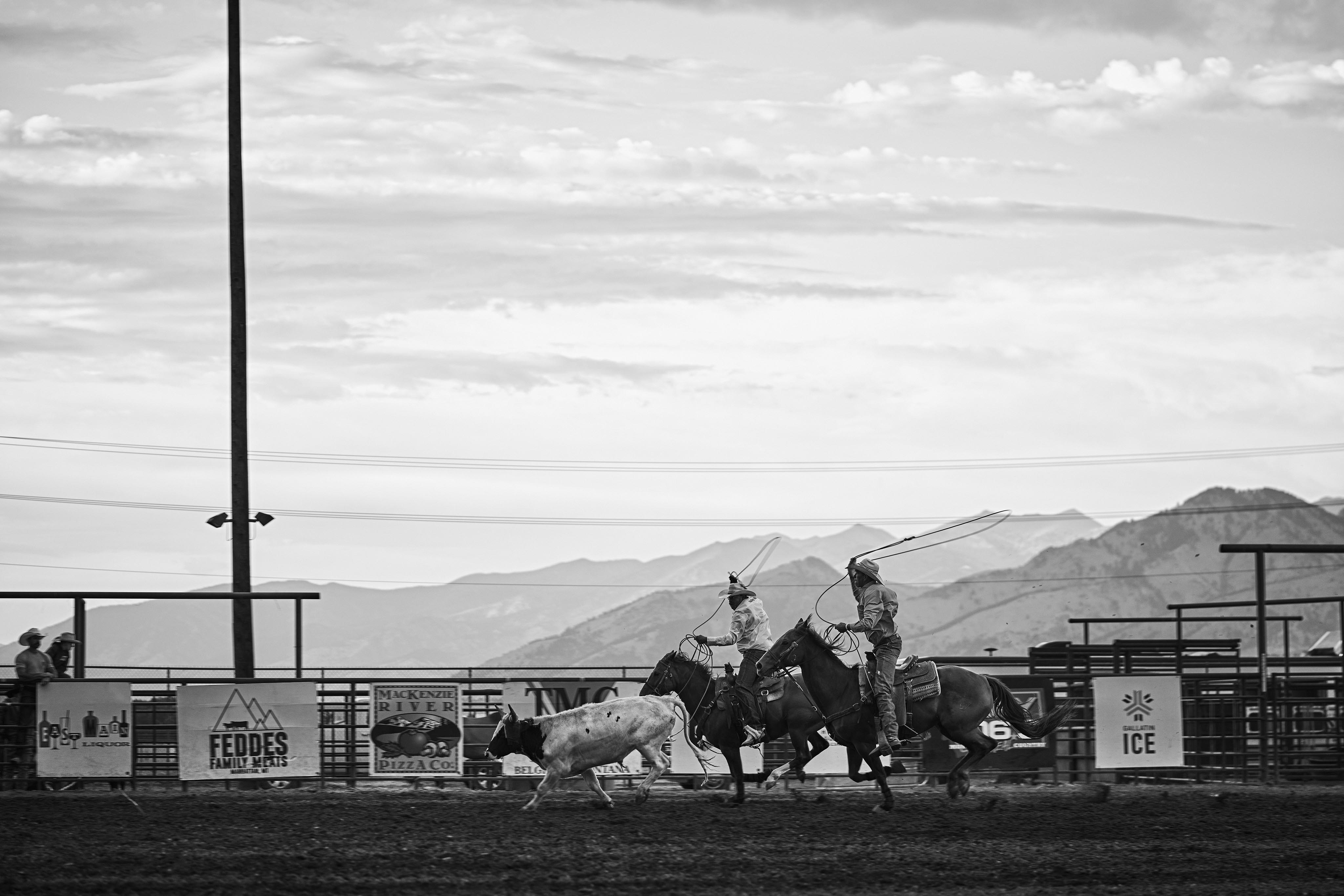 Portrait man on horse at Bozeman rodeo, black and white