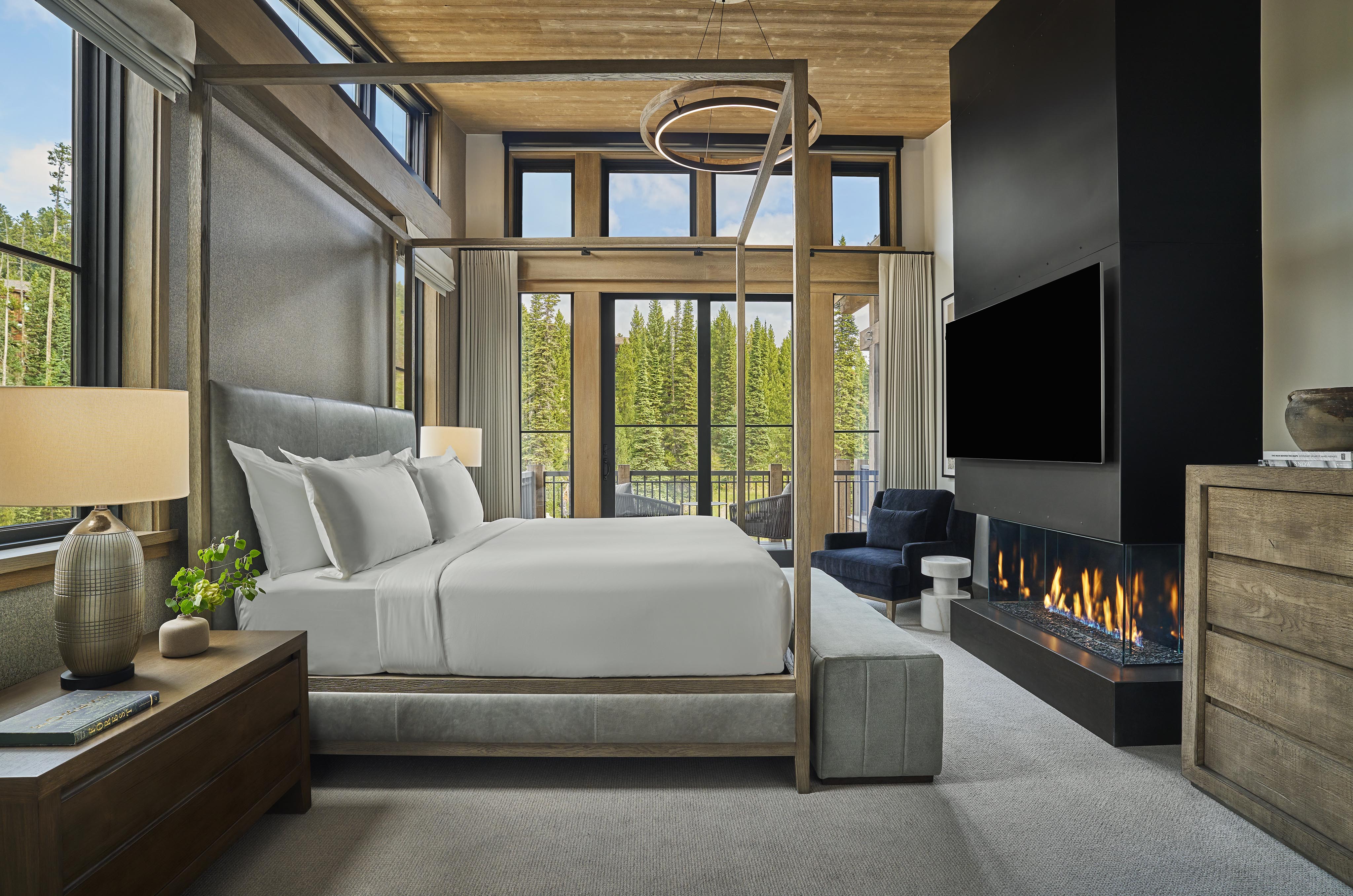 Mountain luxury ski resort suite interior fireplace king bed