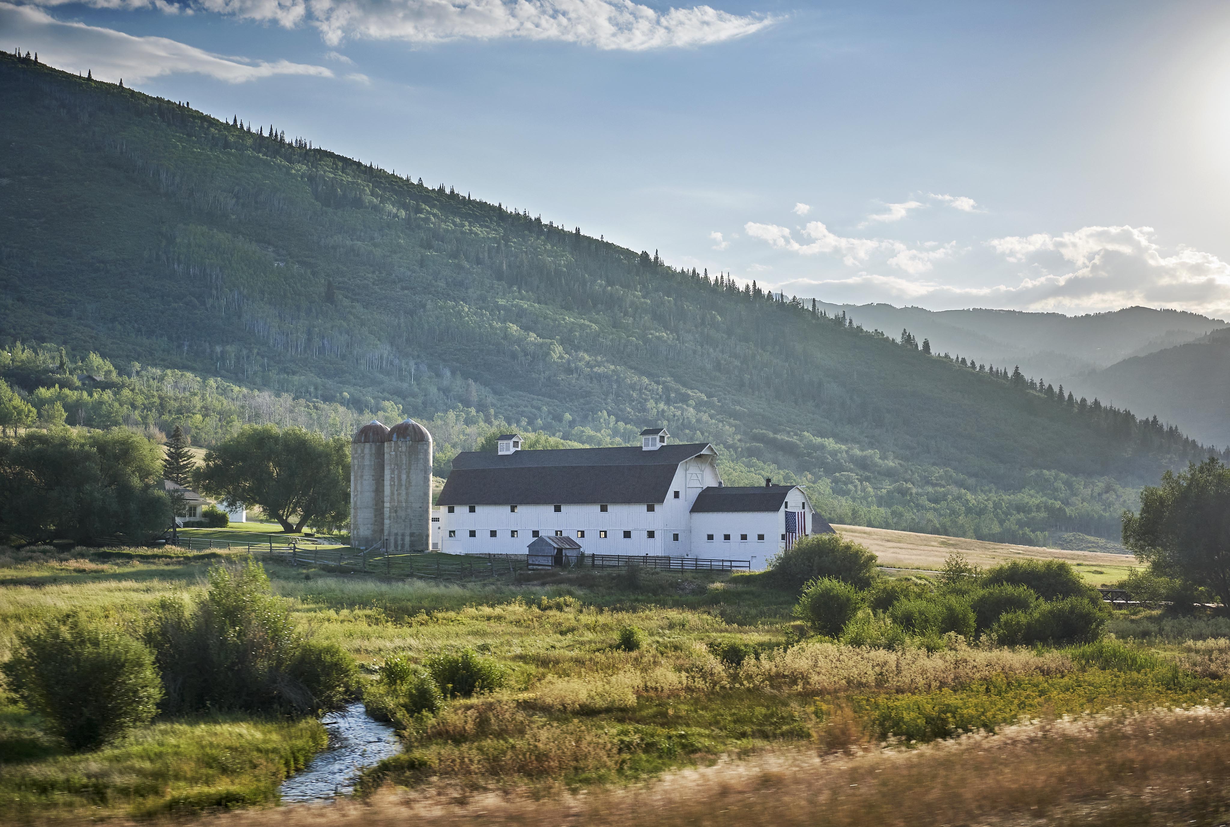 Aerial view exterior architecture Park City luxury hotel, mountains greenery surrounding