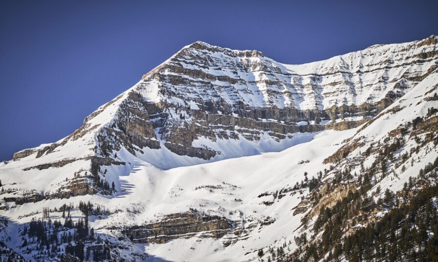 Park City snow covered rocky mountainside