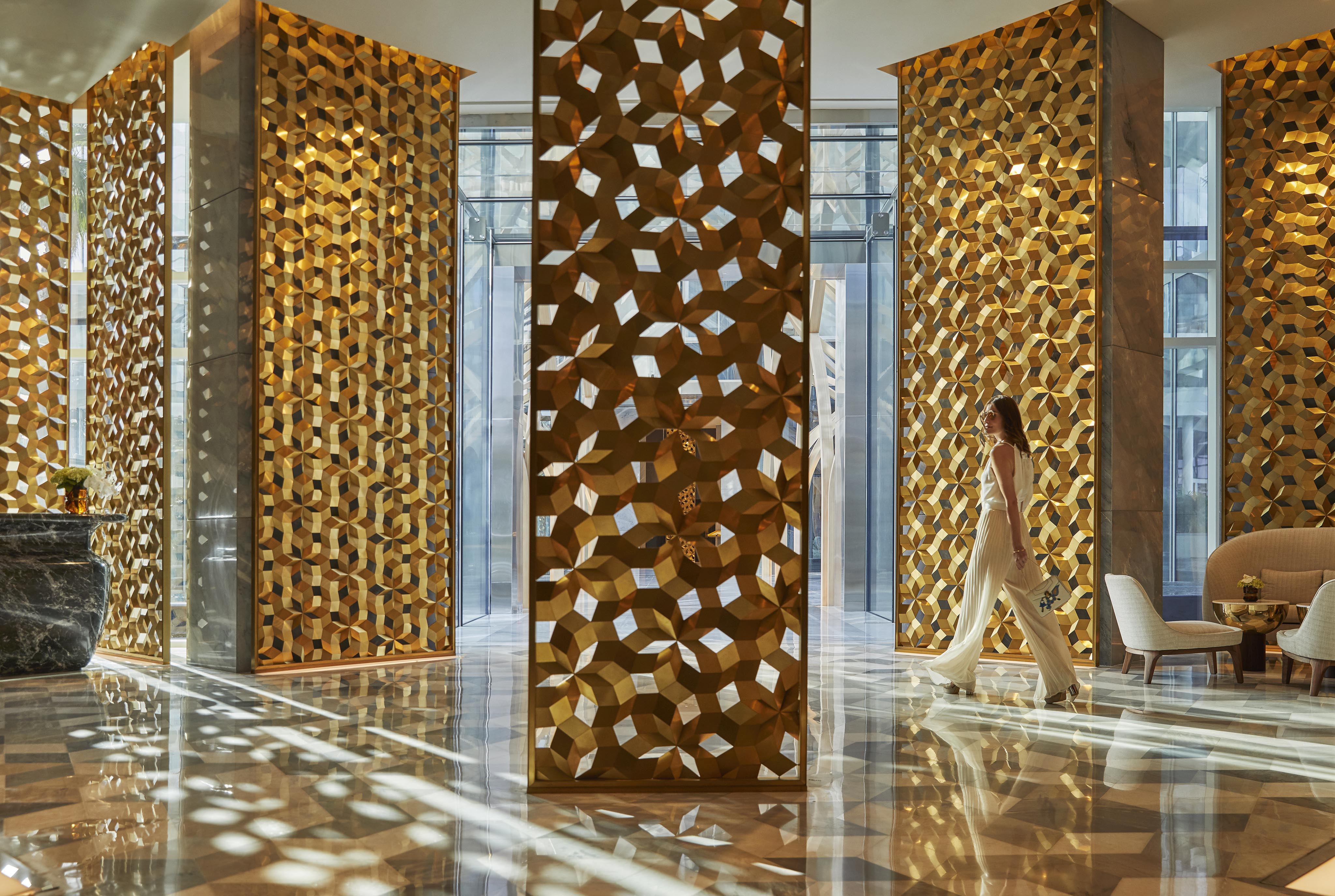 woman walking lobby luxury hotel dubai