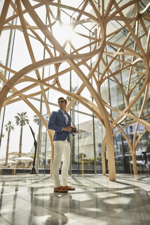man standing in lobby dubai